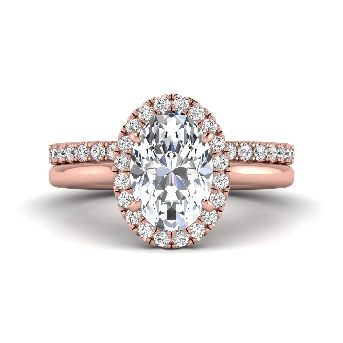 Oval halo lab grown diamond bridal ring set featuring a 2.00 carat oval center diamond with round halo and pavé side diamonds in rose gold finish.
