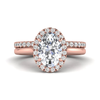 Oval halo lab grown diamond bridal ring set featuring a 2.00 carat oval center diamond with round halo and pavé side diamonds in rose gold finish.
