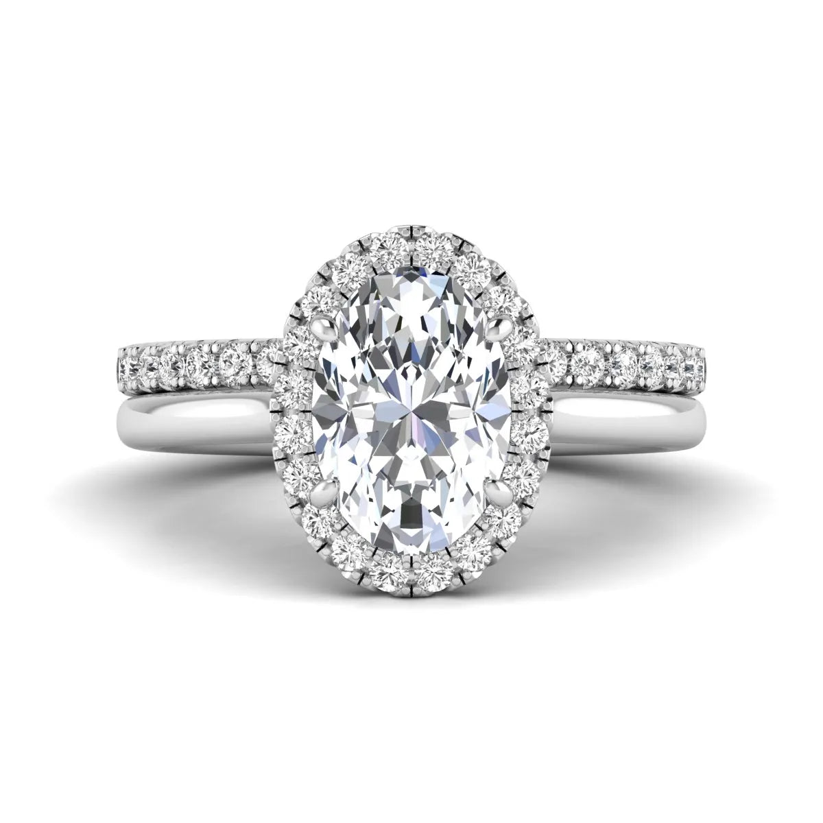 Oval halo lab grown diamond bridal ring set featuring a 2.00 carat oval center diamond with round halo and pavé side diamonds in white gold finish.