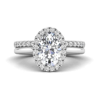 Oval halo lab grown diamond bridal ring set featuring a 2.00 carat oval center diamond with round halo and pavé side diamonds in white gold finish.