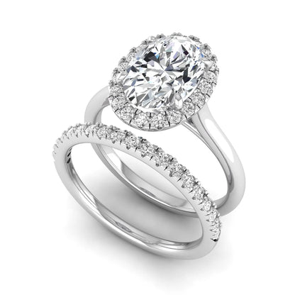 Oval halo lab grown diamond bridal ring set featuring a 2.00 carat oval center diamond with round halo and pavé side diamonds in white gold finish.