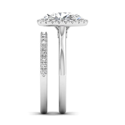 Oval halo lab grown diamond bridal ring set featuring a 2.00 carat oval center diamond with round halo and pavé side diamonds in white gold finish.