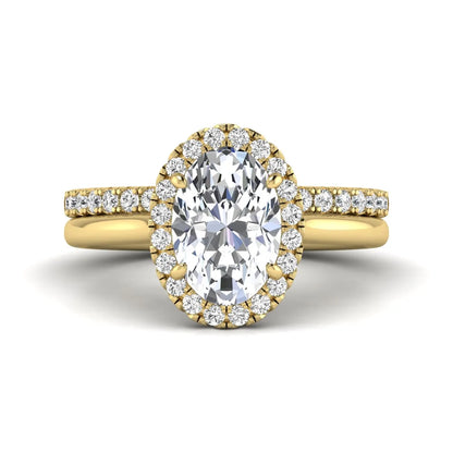 Oval halo lab grown diamond bridal ring set featuring a 2.00 carat oval center diamond with round halo and pavé side diamonds in yellow gold finish.