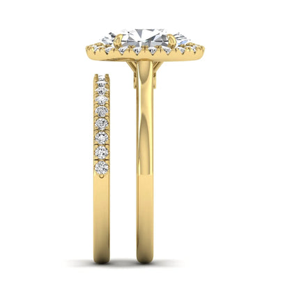 Oval halo lab grown diamond bridal ring set featuring a 2.00 carat oval center diamond with round halo and pavé side diamonds in yellow gold finish.