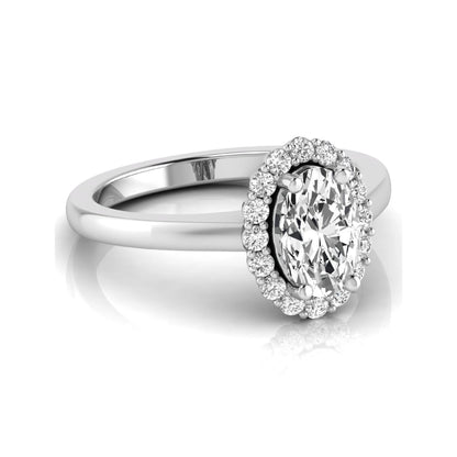 Oval halo lab grown diamond engagement ring featuring a 1.41 carat oval center diamond surrounded by round accent diamonds in a classic halo setting in white gold