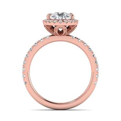 Oval cut lab grown diamond halo engagement ring with pavé round diamonds in a rose gold setting
