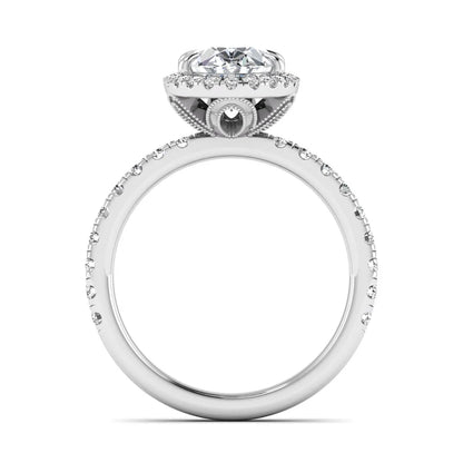 Oval cut lab grown diamond halo engagement ring with pavé round diamonds in a white gold setting