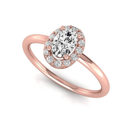 Oval halo lab grown diamond engagement ring featuring a 0.43 carat oval cut center diamond surrounded by round halo diamonds in a rose gold design.