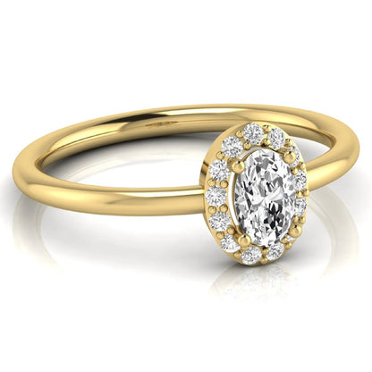 Oval halo lab grown diamond engagement ring featuring a 0.43 carat oval cut center diamond surrounded by round halo diamonds in a yellow gold design.