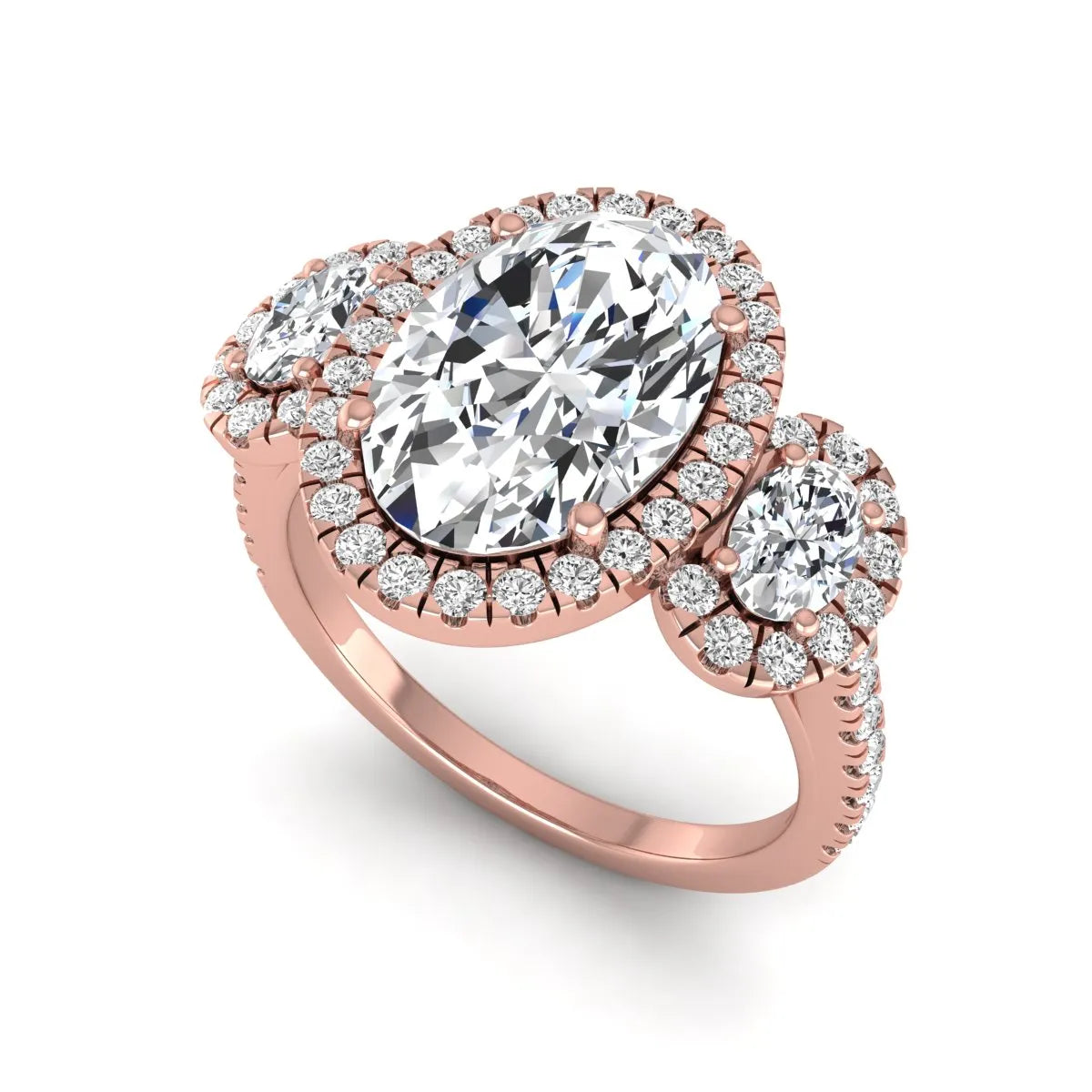 Oval cut lab grown diamond three stone engagement ring featuring a halo center, halo oval side diamonds, pavé shoulders, and a polished rose gold tone band.