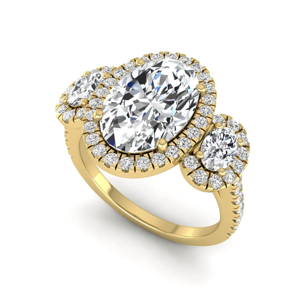 Oval cut lab grown diamond three stone engagement ring featuring a halo center, halo oval side diamonds, pavé shoulders, and a polished yellow gold tone band.