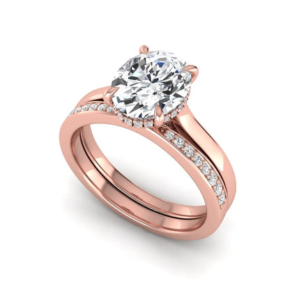 IGI Certified 2.54 carat oval cut lab grown diamond hidden halo bridal ring set with matching diamond wedding band in rose gold.