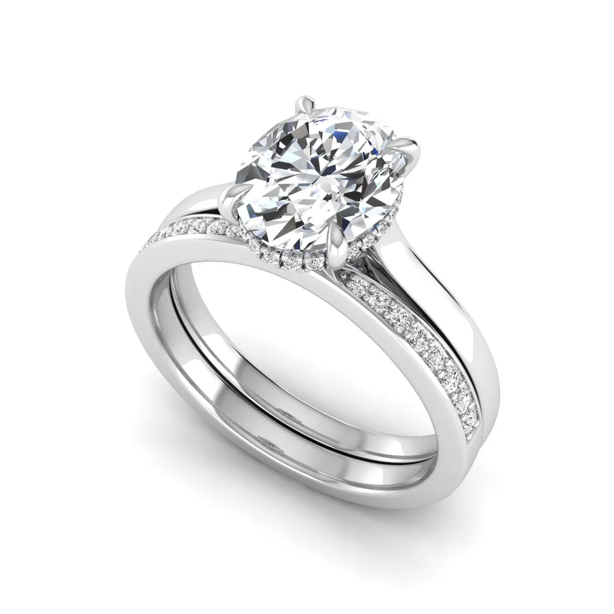 IGI Certified 2.54 carat oval cut lab grown diamond hidden halo bridal ring set with matching diamond wedding band in white gold.