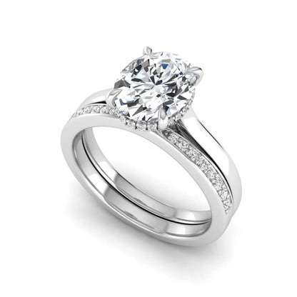 IGI Certified 2.54 carat oval cut lab grown diamond hidden halo bridal ring set with matching diamond wedding band in white gold.