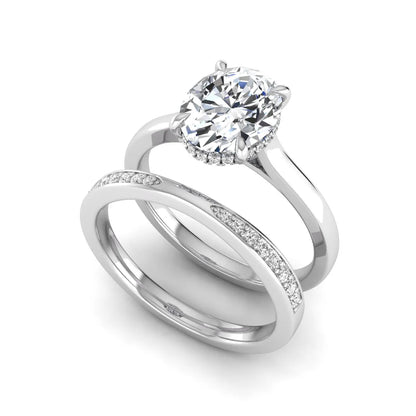IGI Certified 2.54 carat oval cut lab grown diamond hidden halo bridal ring set with matching diamond wedding band in white gold.