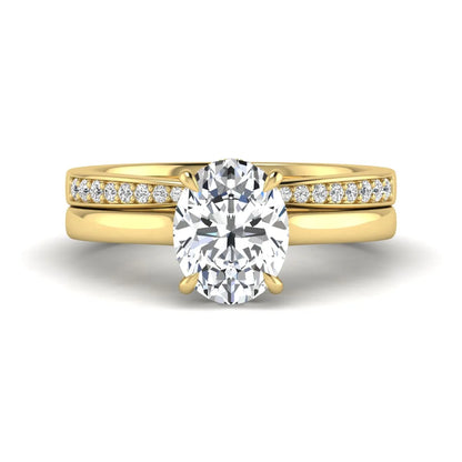 IGI Certified 2.54 carat oval cut lab grown diamond hidden halo bridal ring set with matching diamond wedding band in yellow gold.