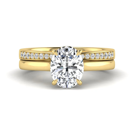 IGI Certified 2.54 carat oval cut lab grown diamond hidden halo bridal ring set with matching diamond wedding band in yellow gold.