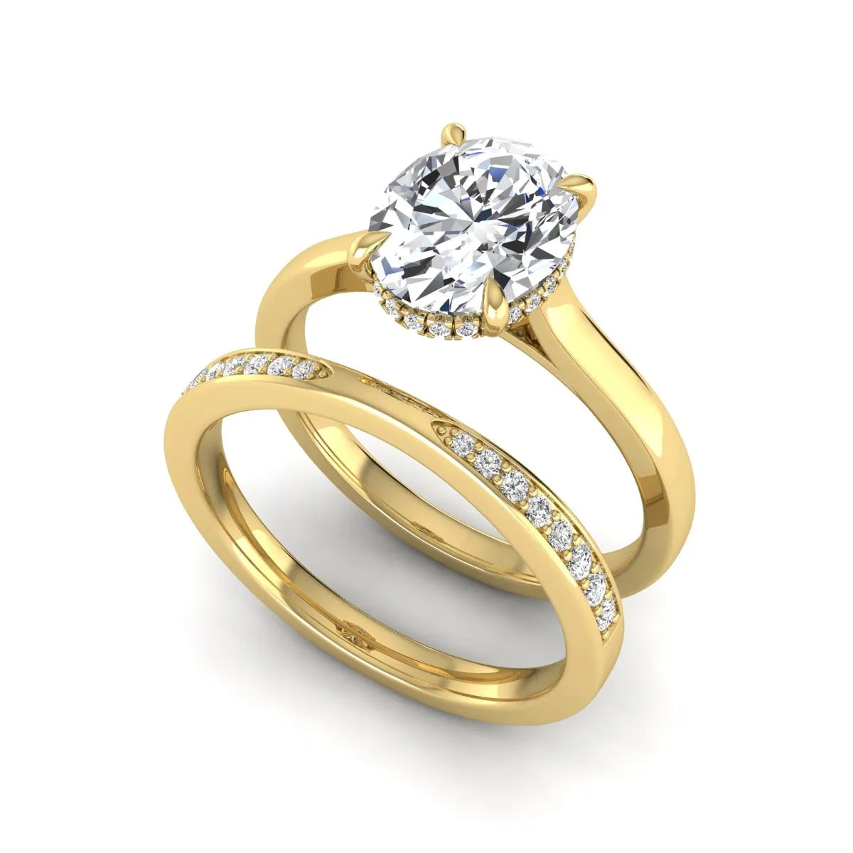 IGI Certified 2.54 carat oval cut lab grown diamond hidden halo bridal ring set with matching diamond wedding band in yellow gold.