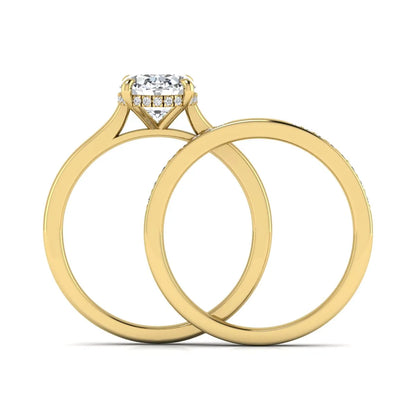 IGI Certified 2.54 carat oval cut lab grown diamond hidden halo bridal ring set with matching diamond wedding band in yellow gold.