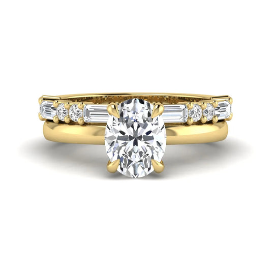 Oval cut lab grown diamond hidden halo bridal ring set featuring baguette and round side diamonds in yellow gold tone design.