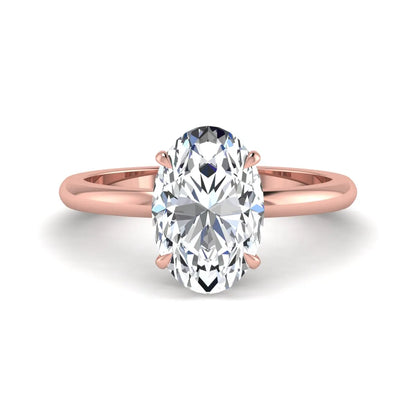 Oval cut hidden halo lab grown diamond engagement ring featuring a 2.99 carat IGI certified center diamond with round hidden halo accents in rose gold.