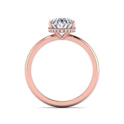 Oval cut hidden halo lab grown diamond engagement ring featuring a 2.99 carat IGI certified center diamond with round hidden halo accents in rose gold.