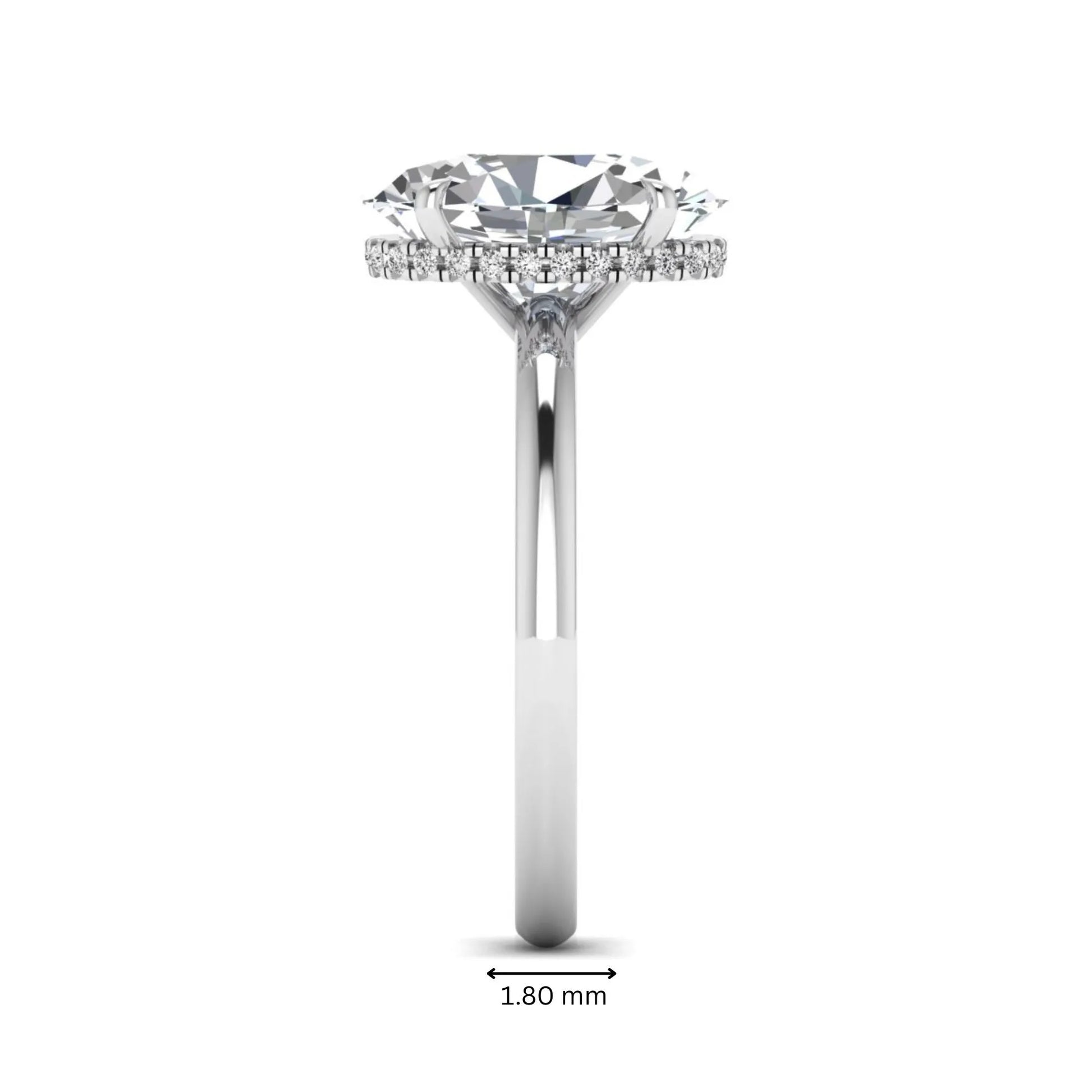 Oval cut hidden halo lab grown diamond engagement ring featuring a 2.99 carat IGI certified center diamond with round hidden halo accents in white gold.