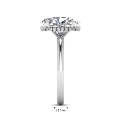 Oval cut hidden halo lab grown diamond engagement ring featuring a 2.99 carat IGI certified center diamond with round hidden halo accents in white gold.