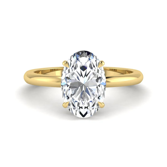 Oval cut hidden halo lab grown diamond engagement ring featuring a 2.99 carat IGI certified center diamond with round hidden halo accents in yellow gold.