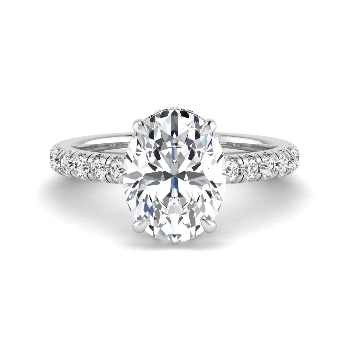 Oval cut lab grown diamond hidden halo engagement ring with pavé band and four-prong setting in a white gold tone design.