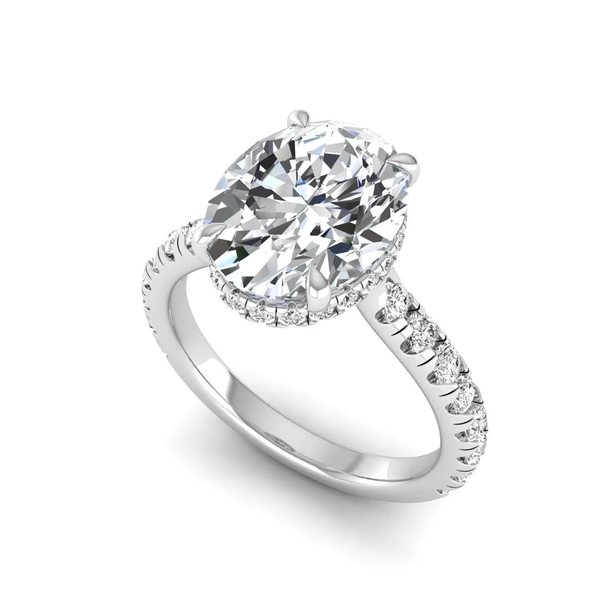 Oval cut lab grown diamond hidden halo engagement ring with pavé band and four-prong setting in a white gold tone design.