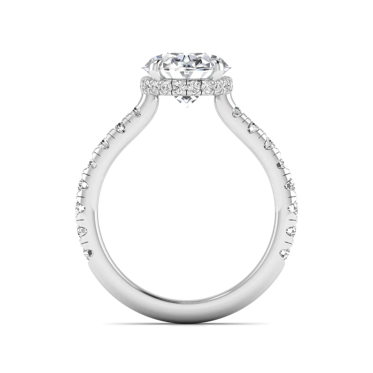 Oval cut lab grown diamond hidden halo engagement ring with pavé band and four-prong setting in a white gold tone design.