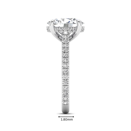 IGI Certified 2.54 carat oval cut lab grown diamond hidden halo pavé engagement ring with round accent diamonds in white gold.
