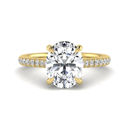 IGI Certified 2.54 carat oval cut lab grown diamond hidden halo pavé engagement ring with round accent diamonds in yellow gold.