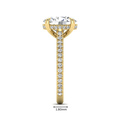 IGI Certified 2.54 carat oval cut lab grown diamond hidden halo pavé engagement ring with round accent diamonds in yellow gold.