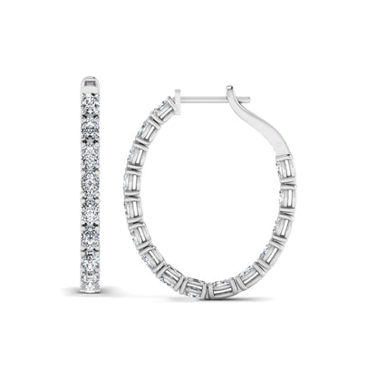 Oval cut lab grown diamond inside-out hoop earrings featuring shared prong settings, hinged snap closure, and white gold tone design.