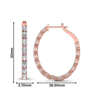 Oval cut lab grown diamond inside-out hoop earrings featuring shared prong settings, hinged snap closure, and rose gold tone design.