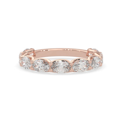 Oval lab grown diamond half eternity wedding band in a selected metal color with shared prong setting in rose gold