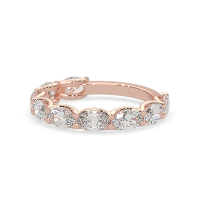 Oval lab grown diamond half eternity wedding band in a selected metal color with shared prong setting in rose gold