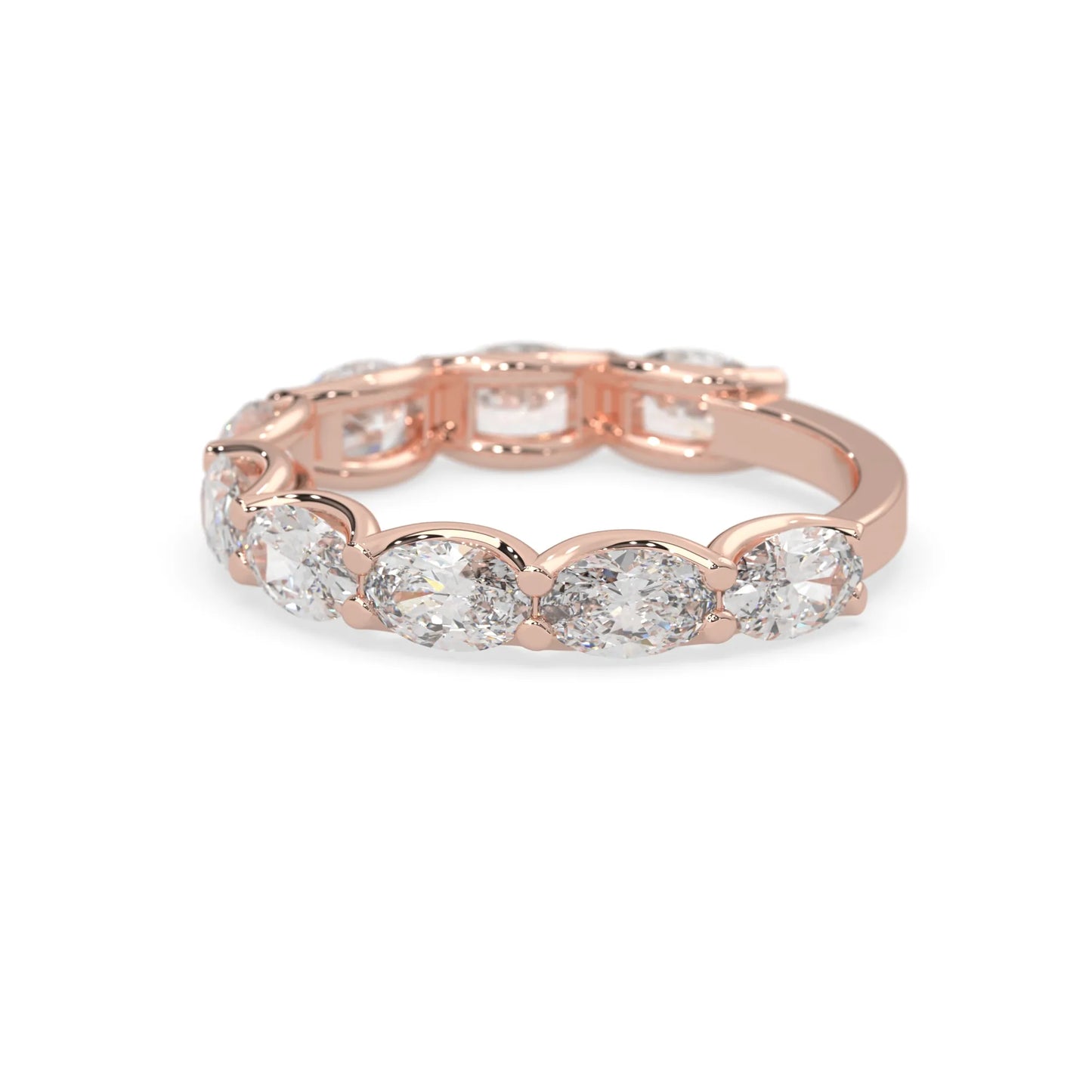 Oval lab grown diamond half eternity wedding band in a selected metal color with shared prong setting in rose gold