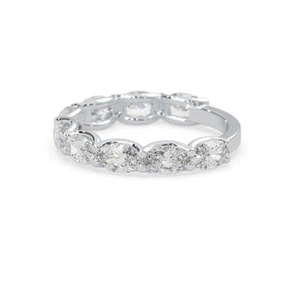 Oval lab grown diamond half eternity wedding band in a selected metal color with shared prong setting in white gold