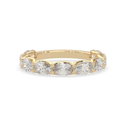 Oval lab grown diamond half eternity wedding band in a selected metal color with shared prong setting in yellow gold