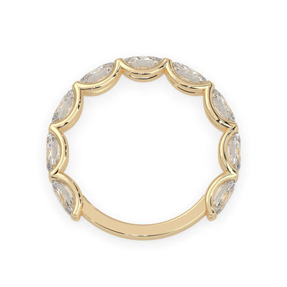 Oval lab grown diamond half eternity wedding band in a selected metal color with shared prong setting in yellow gold