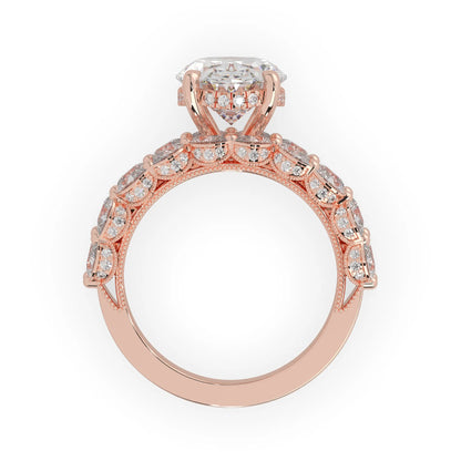Oval lab grown diamond cocktail ring with emerald, round, and pear diamond accents in rose gold