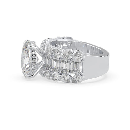 Oval lab grown diamond cocktail ring with emerald, round, and pear diamond accents in white gold