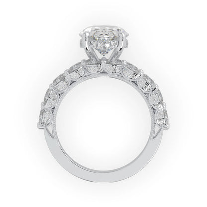 Oval lab grown diamond cocktail ring with emerald, round, and pear diamond accents in white gold