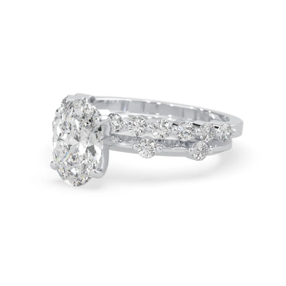 oval lab grown diamond pave wedding bridal ring set with sparkling round diamonds along the band in white gold
