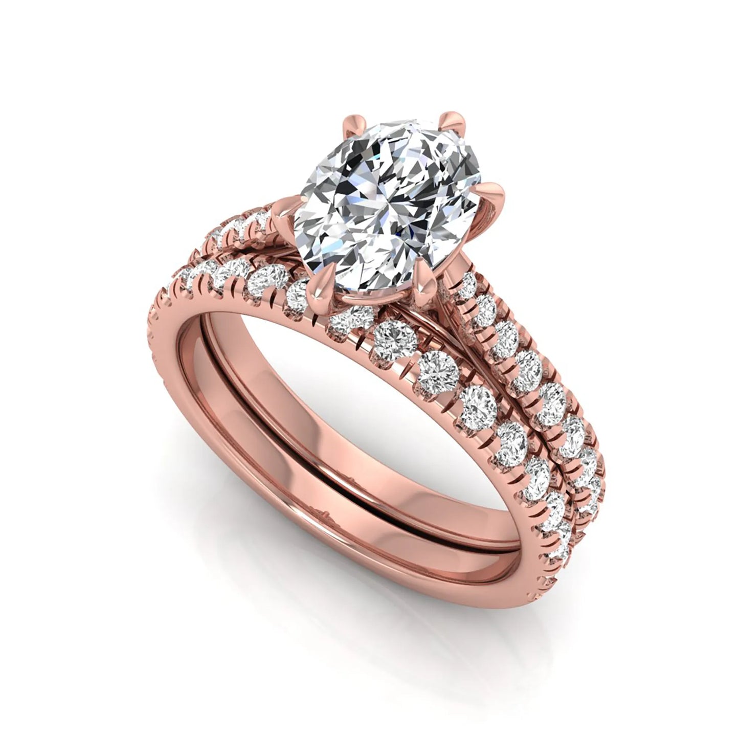 Oval cut lab grown diamond bridal ring set with pavé engagement ring and matching diamond wedding band in rose gold style.