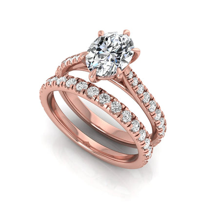 Oval cut lab grown diamond bridal ring set with pavé engagement ring and matching diamond wedding band in rose gold style.
