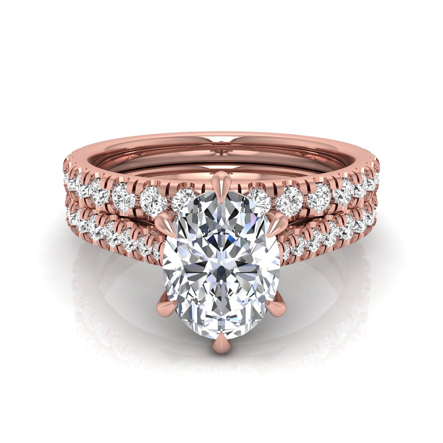 Oval cut lab grown diamond bridal ring set with pavé engagement ring and matching diamond wedding band in rose gold style.